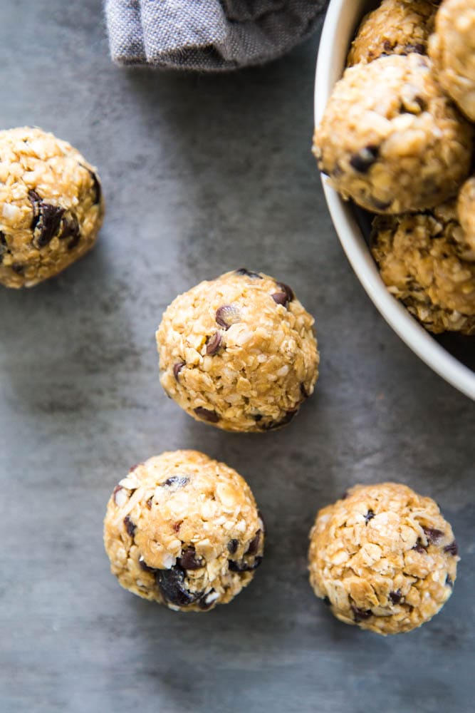 peanut butter protein balls next to a bowl.