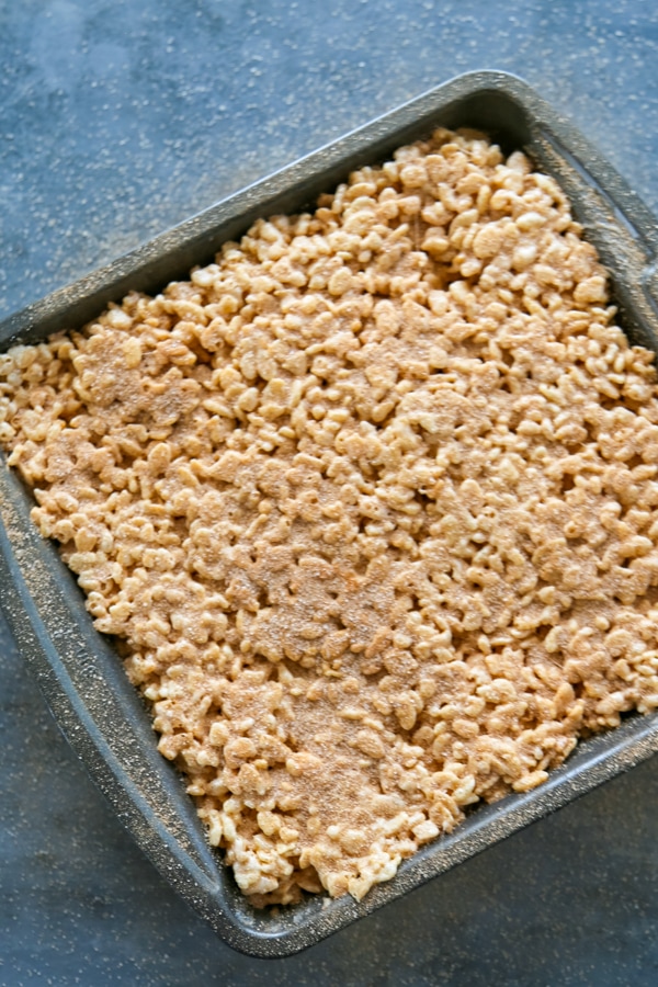 overhead shot of churro rice krispie treats in a pan.