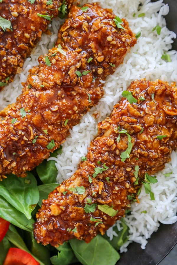 overhead shot of the cashew crusted chicken on a bed of rice.
