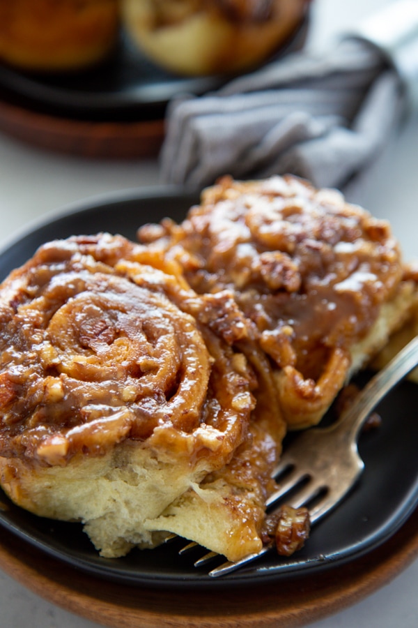 close-up shot of two rolls on a plate.