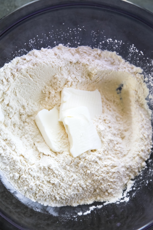 dry ingredients and shortening in a bowl.