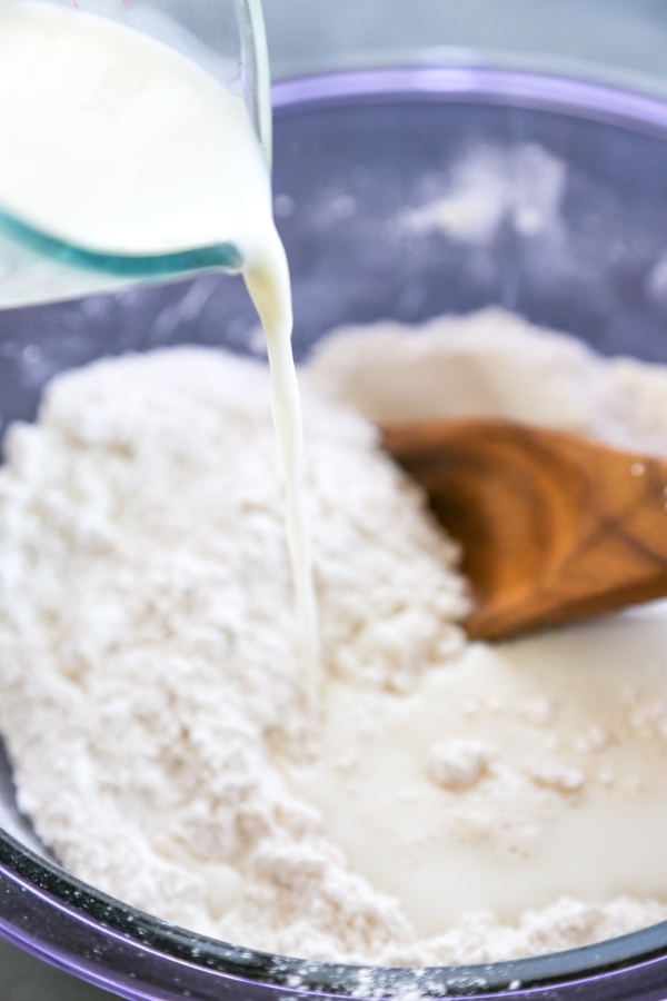 milk being poured into the bowl.