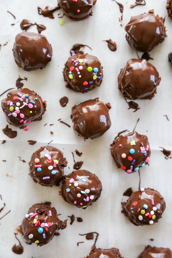 overhead shot of the brownie bites coated in chocolate and sprinkles.
