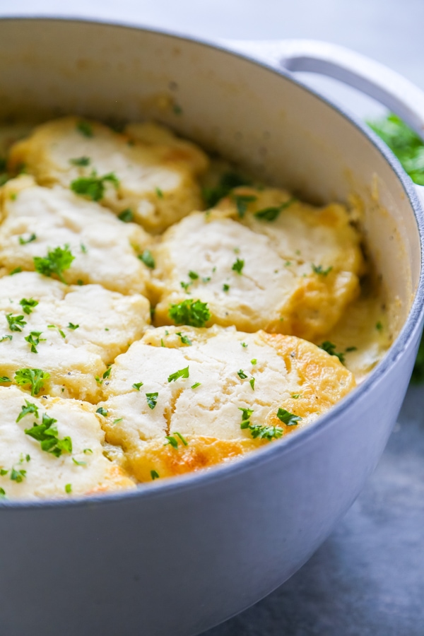 This One Pot Chicken & Biscuits is a simple and delicious recipe with biscuits made from scratch. A fantastic classic comfort food brought to you in bowl.