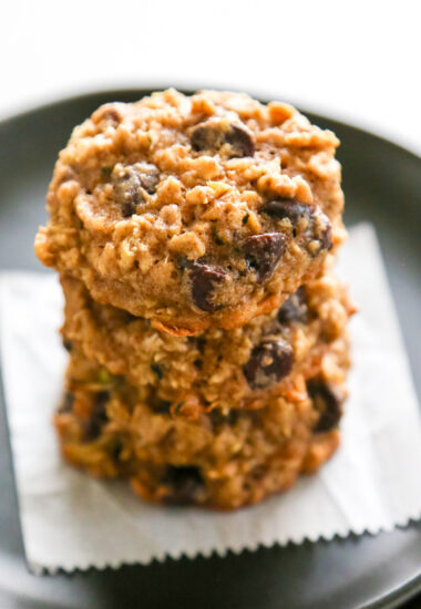 a close-up shot of a stack of zucchini oatmeal cookies.