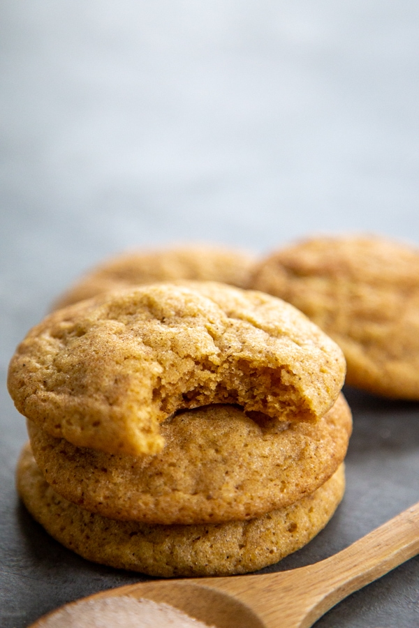 pumpkin snickerdoodle cookie with a bite out of it