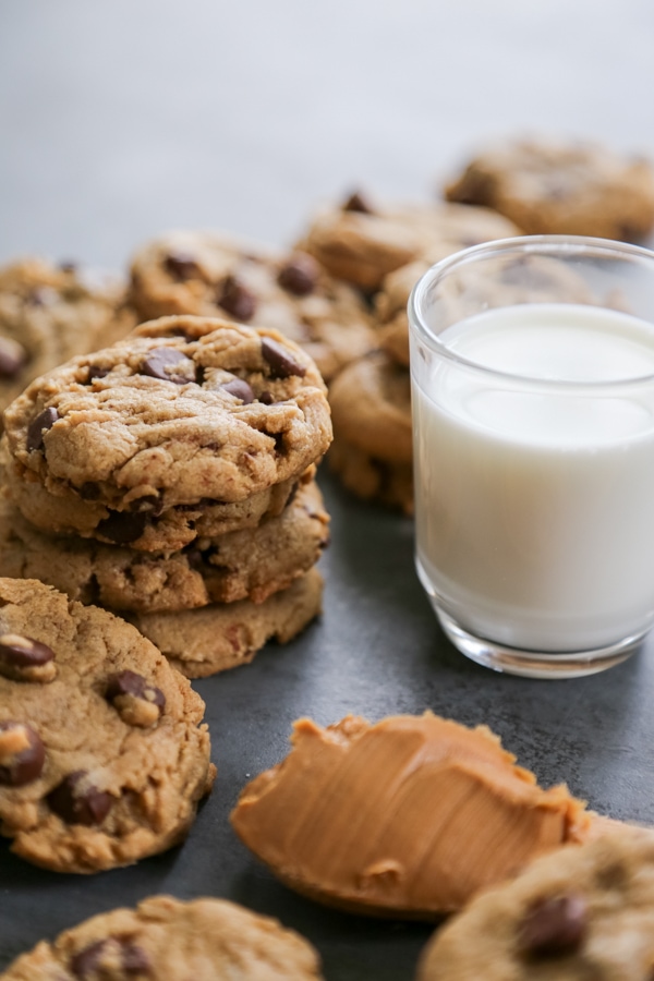 cookies stacked around a glass of milk.