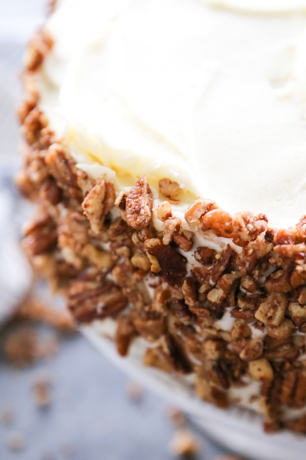 a close up of the side of the cake with the walnuts.