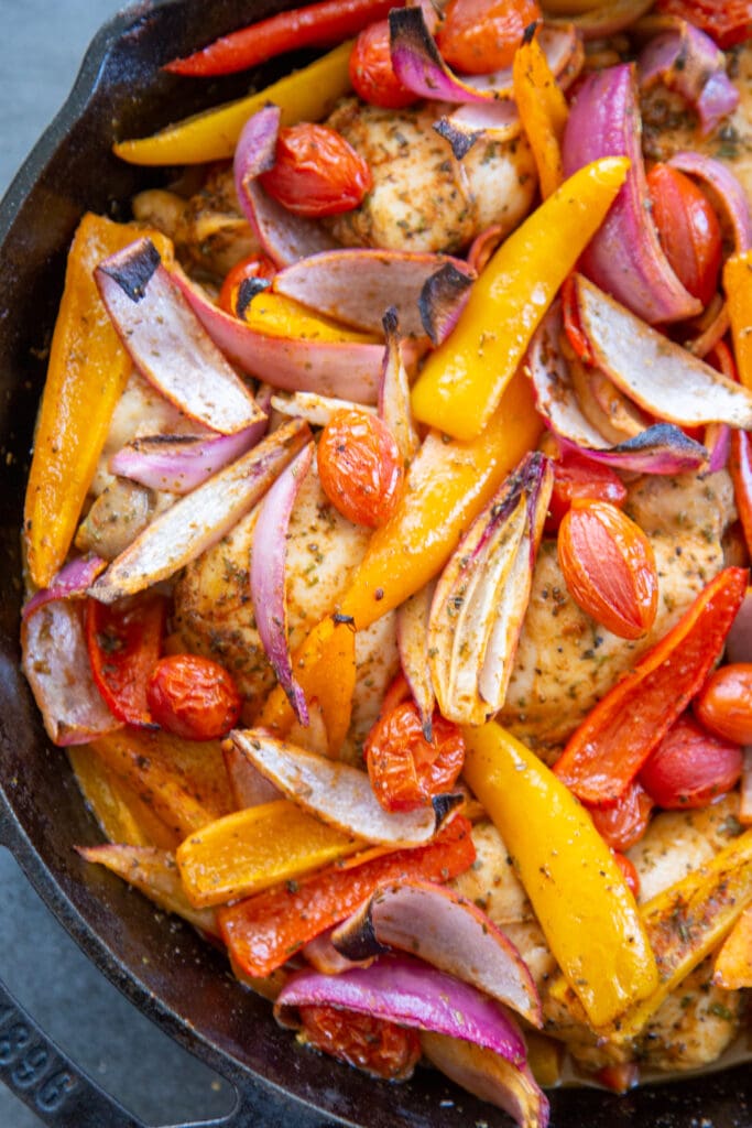 overhead shot of the chicken and vegetables in a skillet.