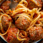 a bowl of spaghetti and meatballs.