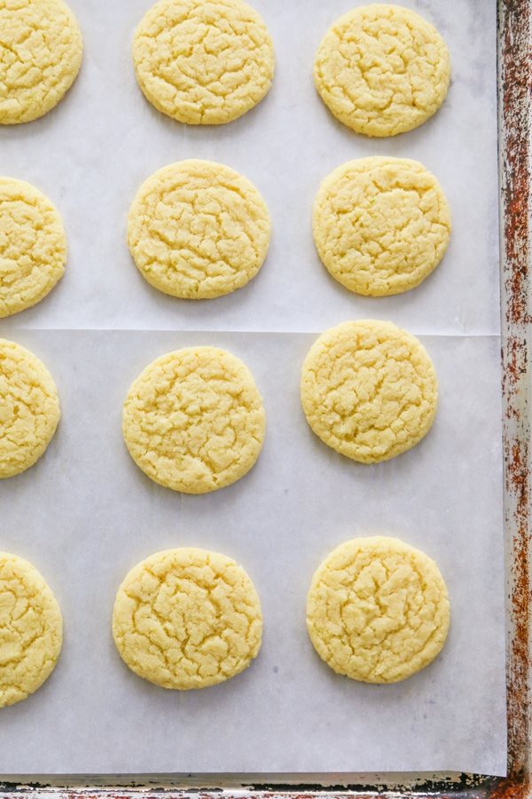 Key Lime Sugar Cookies lined up on a baking sheet.