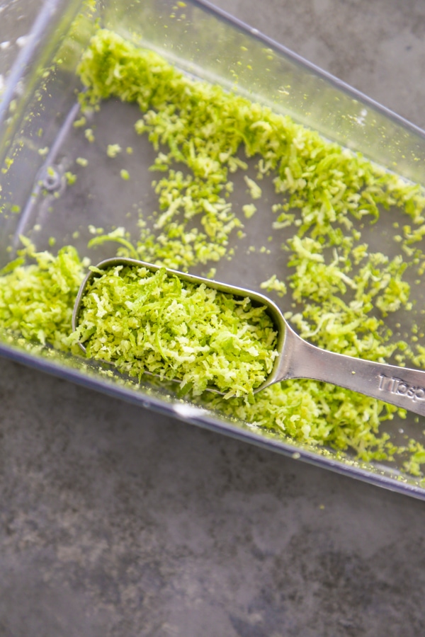 lime zest in a measuring spoon.