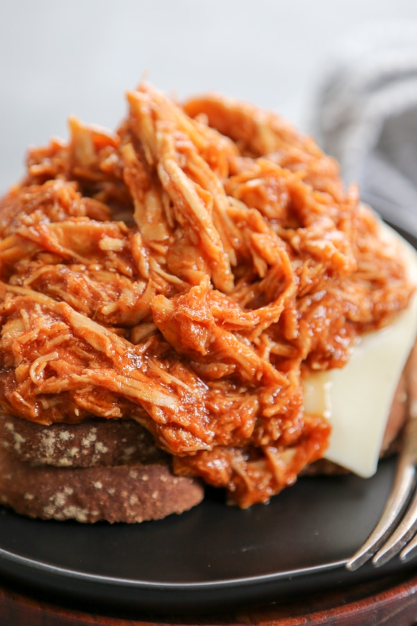 shredded chipotle chicken on top of two bread slices.