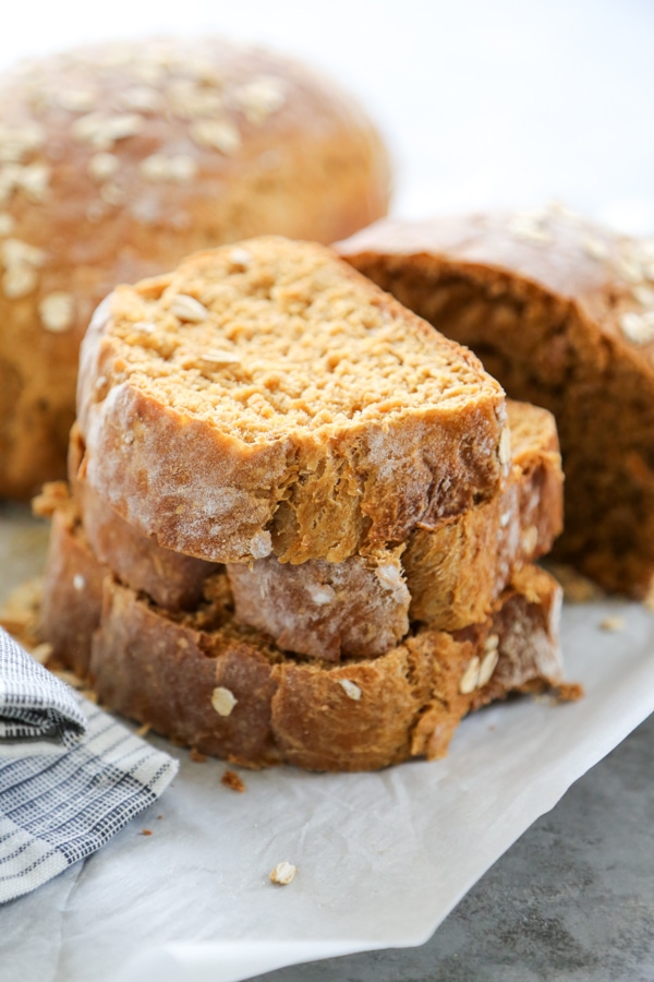 a stack of three pieces of oatmeal bread.