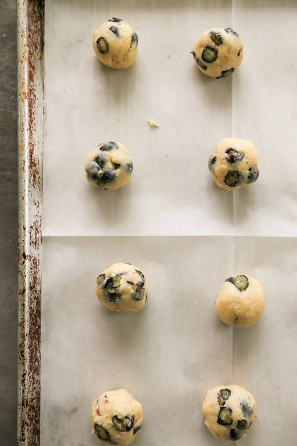 overhead shot of the cookie dough balls on a baking sheet.