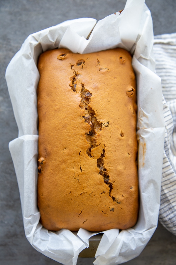 overhead shot of the baked bread in a loaf pan.