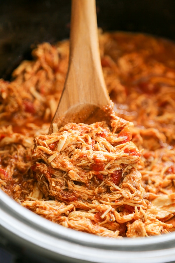 close-up of the shredded chili chicken in a slow cooker.