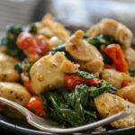 Italian chicken on a plate with a fork.