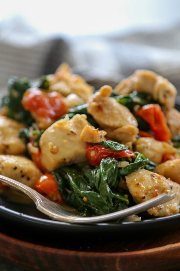 Italian chicken on a plate with a fork.