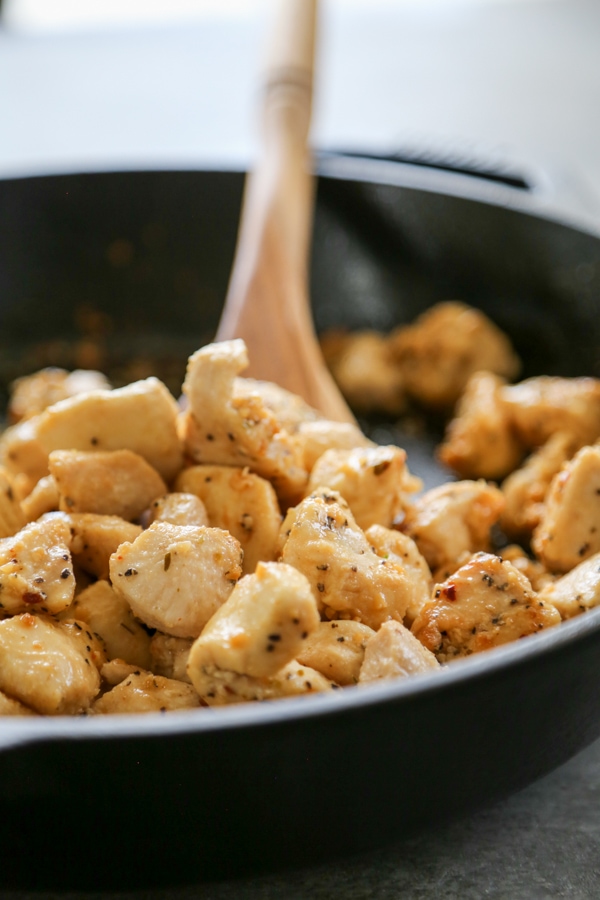 the chicken cooking in a skillet.