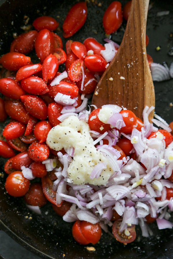 the tomatoes and onions in the skillet.