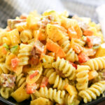 close-up shot of mango pasta salad on a plate.