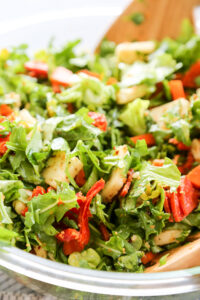 close up shot of Italian kale salad in a serving bowl.