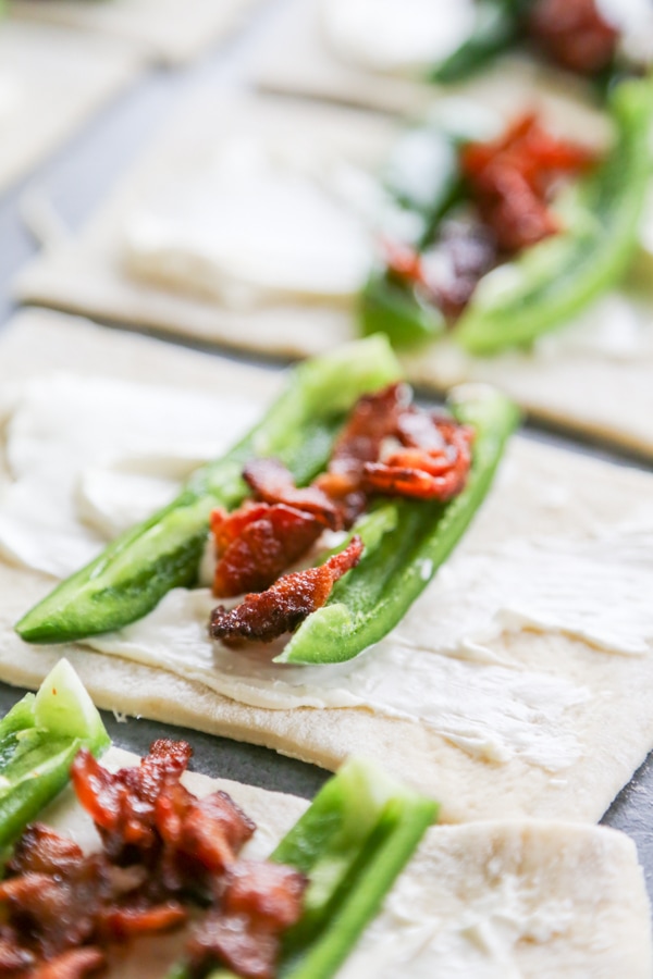 peppers and bacon on the dough pieces.