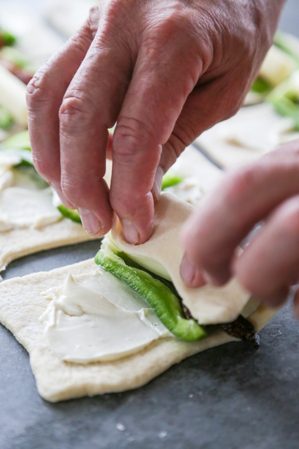 the dough being rolled up.