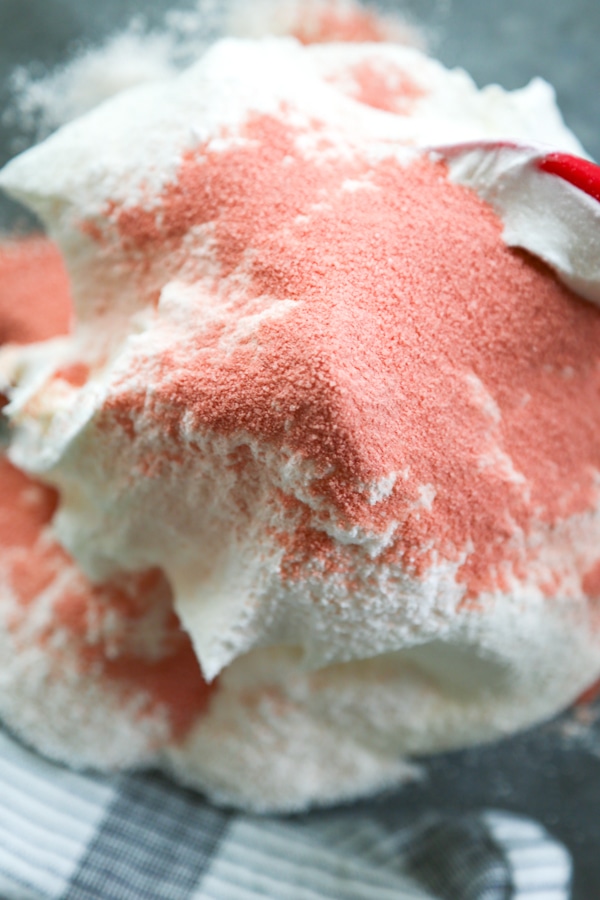 strawberry jello mix added to the bowl.