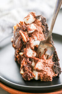 chocolate cheesecake with fudge, marshmallows and pecans