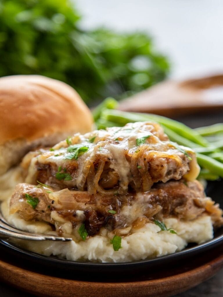 close up shot of pork chops on plate