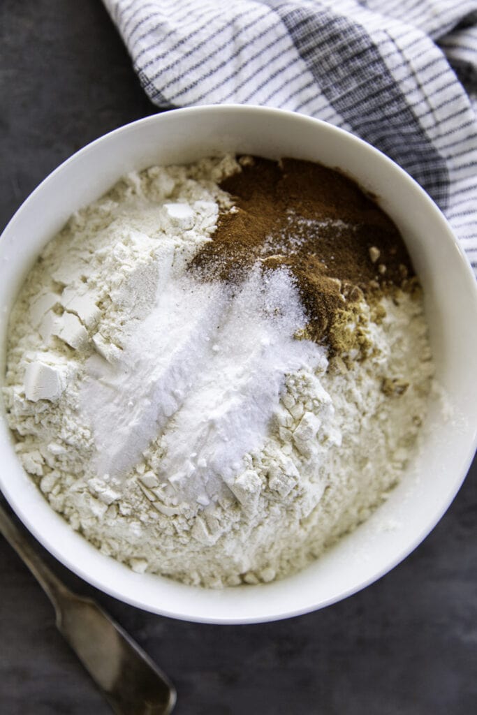 flour and pumpkin spice seasonings overhead shot in white bowl