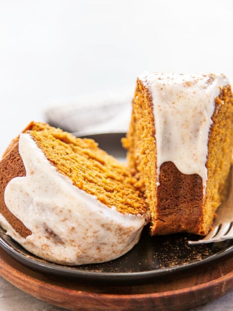 two slice of bundt cake frosted on plate