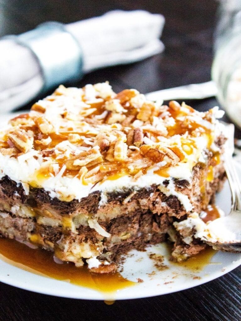german chocolate ice box cake pie on white plate with bite taken out of it