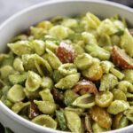 bowl of pesto pasta salad with veggies