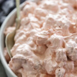 close up shot of raspberry fluff salad in bowl