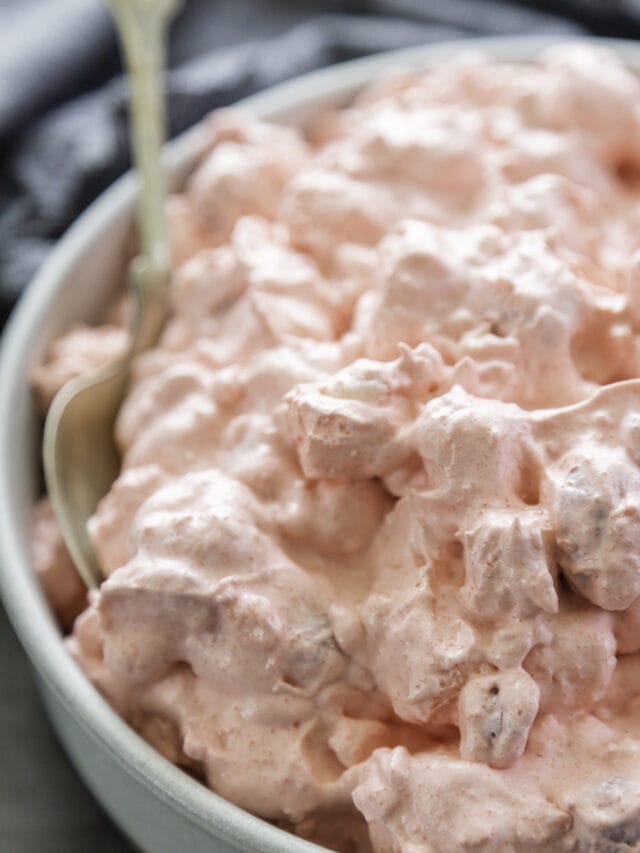 close up shot of raspberry fluff salad in bowl