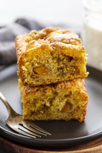 peach coffee cake stacked on plate