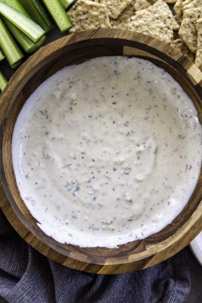 overhead shot of sour cream dip in wood bowl