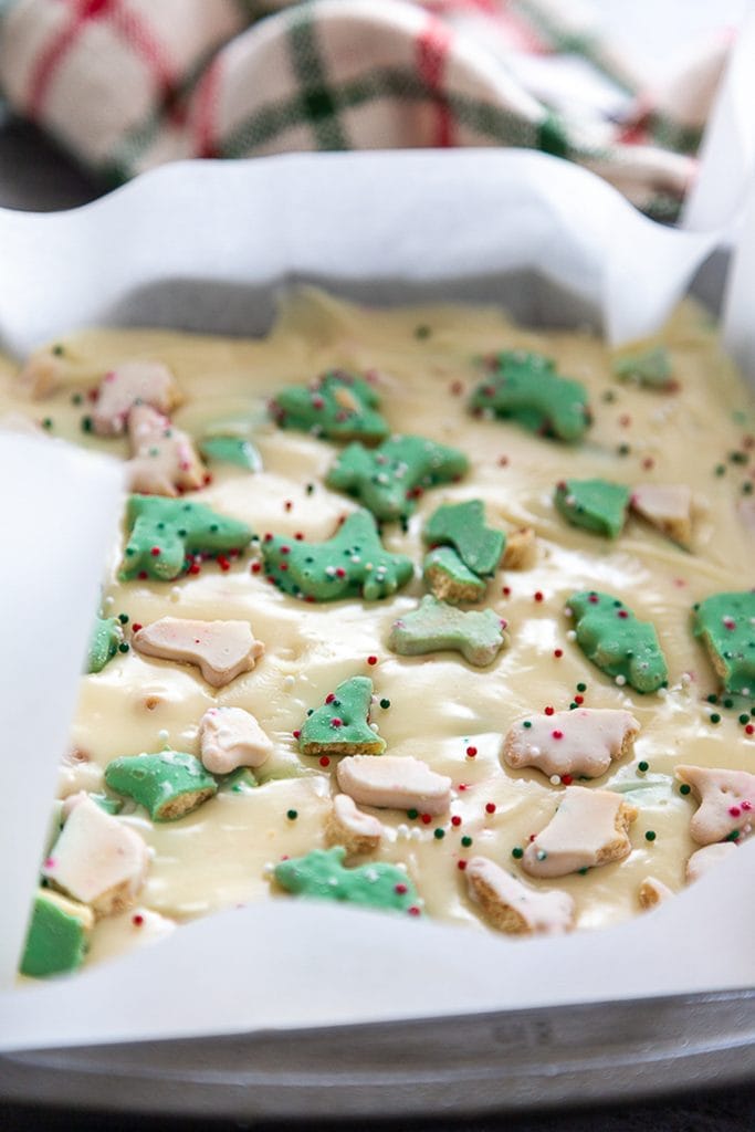 white chocolate fudge with christmas cookies in pan