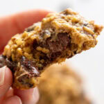 chocolate chip cookie made with oatmeal and zucchini with bite out of it