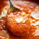 bowl of tomato soup with spoon