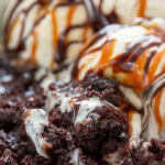 spoon with ice cream and brownies