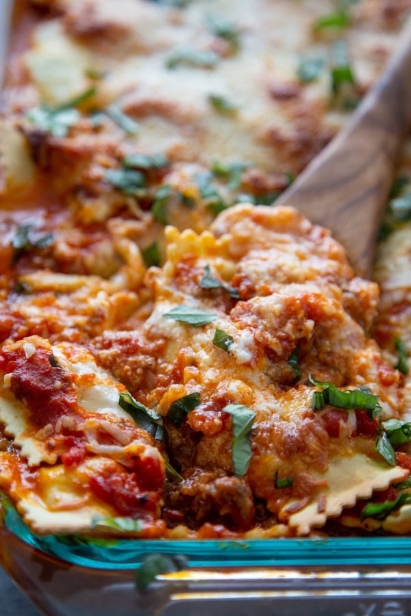 pan of ravioli lasagna with serving spoon