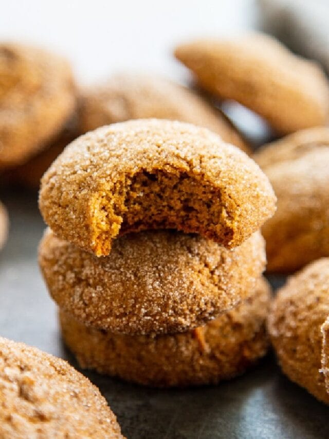 stack pumpkin ginger cookies with bite out of the top one