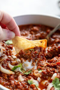 bowl of chili with chip