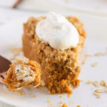 pumpkin pie slice on plate with fork