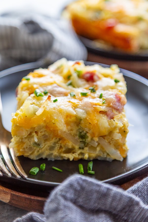 piece of breakfast casserole on plate with fork