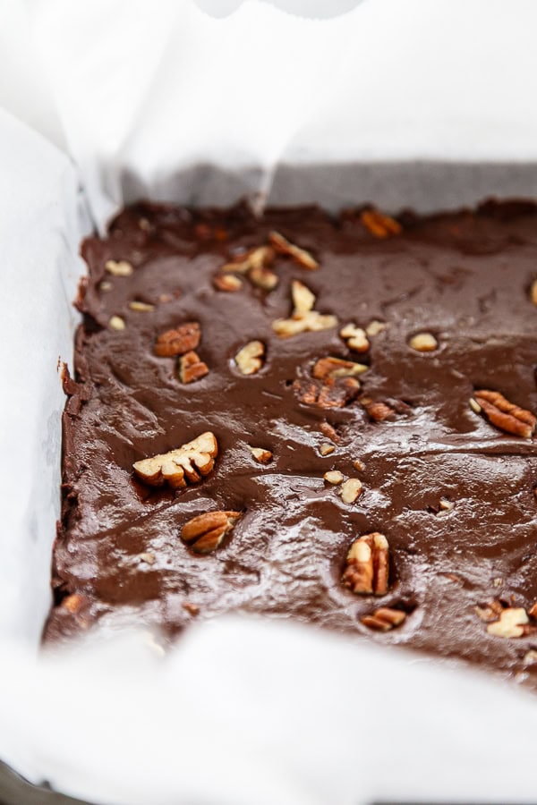 pecan fudge in pan with parchment paper